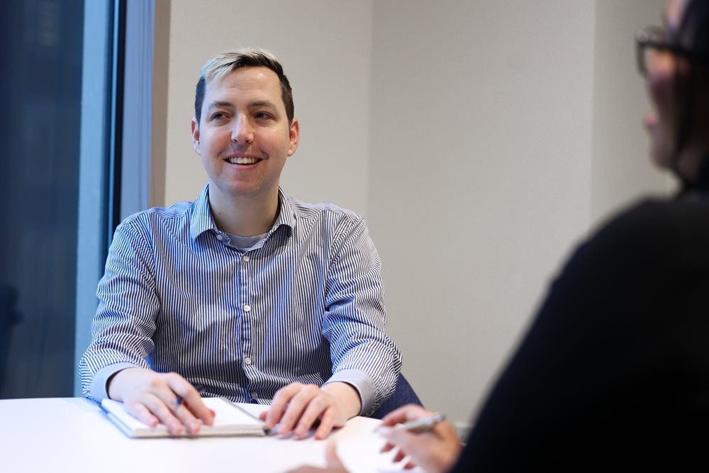 Image of Daniel Ruvolo in a meeting with colleagues.